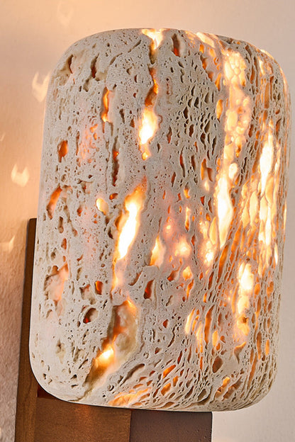 Detailed macro shot of glowing travertine stone | Travertine | Showing the natural pores and warm light diffusion | vexa lamps