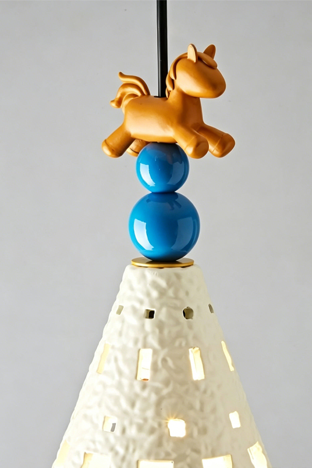 Whimsy Ceramic & Resin Pendant Light showcasing a textured cone shade with playful horse topper and blue accents.
