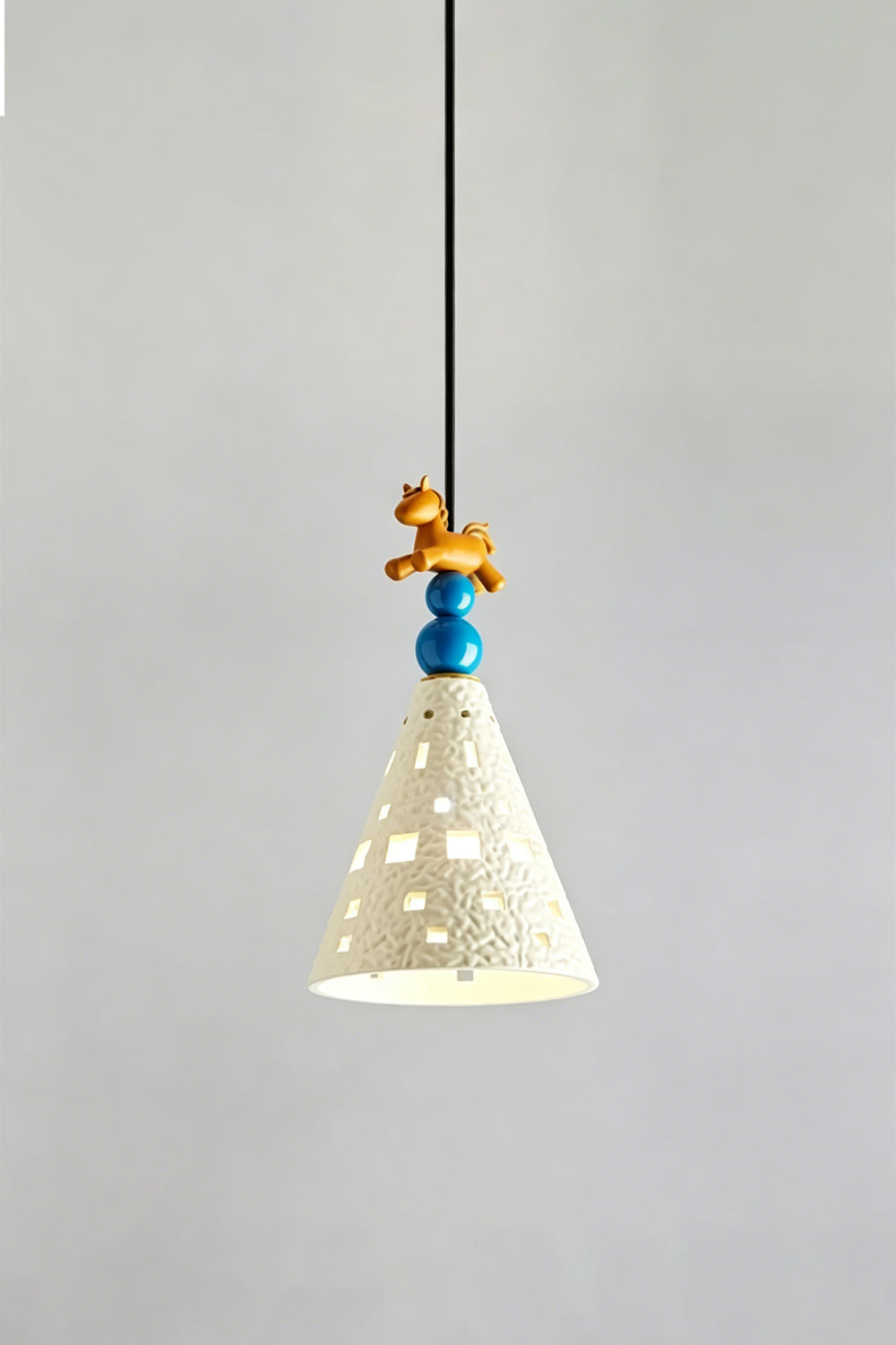 Whimsy Ceramic & Resin Pendant Light featuring a textured cone shade and playful resin details.