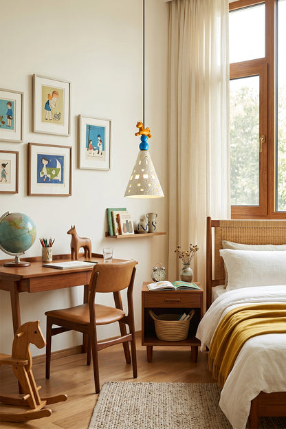 Whimsy Ceramic & Resin Pendant Light illuminating a children's room with wooden furniture and playful decor.