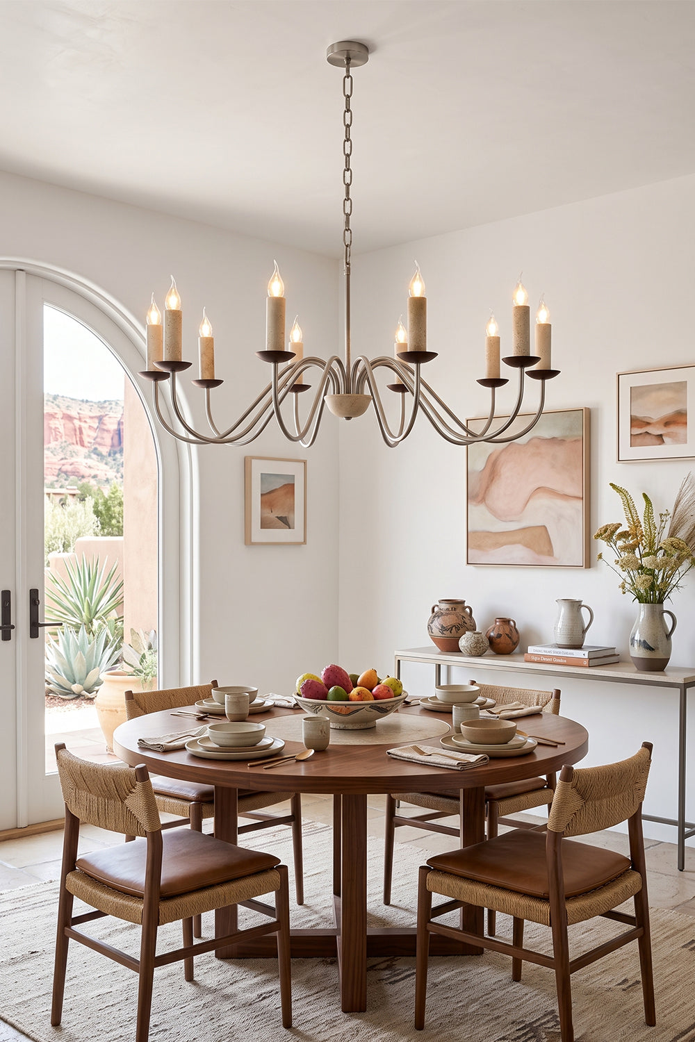 Winslow Travertine Candelabra Chandelier | Natural Travertine and Metal | Hanging above a round wooden table in a bright dining room | vexa lamps