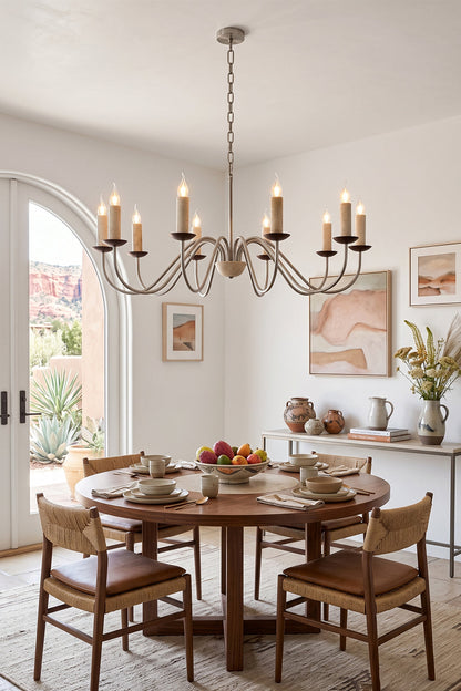 Winslow Travertine Candelabra Chandelier | Natural Travertine and Metal | Hanging above a round wooden table in a bright dining room | vexa lamps